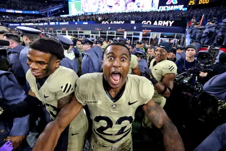 Dec 9, 2023; Foxborough, Massachusetts, USA; Army Black Knights running back Miles Stewart (22) celebrates after a 17-11 win against the Navy Midshipmen in the Army-Navy Game at Gillette Stadium. Mandatory Credit: Danny Wild-USA TODAY Sports
