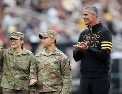 Aug 30, 2024; West Point, New York, USA; Army West Point athletic director Mike Buddie participates in an on-field ceremony with soldiers from the 101st Airborne Division during the first half of a game between Army and the Lehigh Mountain Hawks at Michie Stadium. Mandatory Credit: Danny Wild-USA TODAY Sports