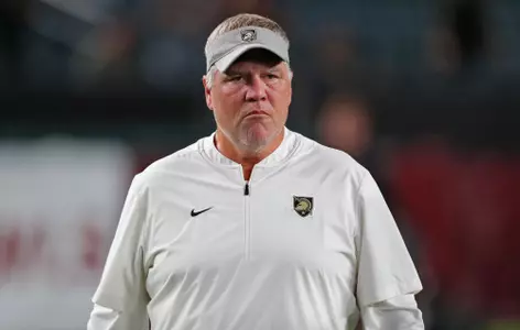 Sep 26, 2024; Philadelphia, Pennsylvania, USA; Army Black Knights defensive coordinator Nate Woody watches his players warm up before the first half against the Temple Owls at Lincoln Financial Field. Mandatory Credit: Danny Wild-Imagn Images