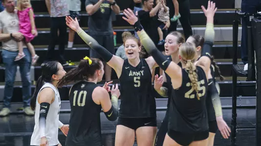 Volleyball Celebrates a Point Inside Gillis Field House