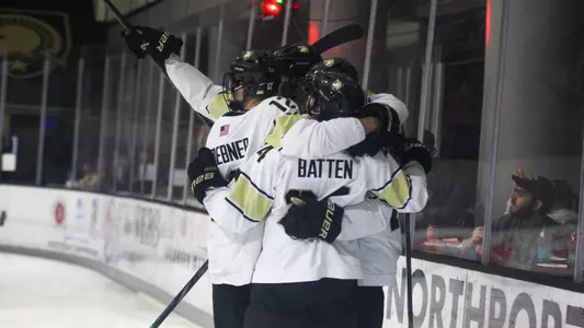 Batten and Teammates Celebrating After a Goal