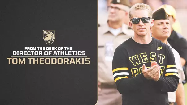 Graphic featuring From the Desk of AD #31 text on the left side and a photo of Director of Athletics Tom Theodorakis clapping on the right side at a football game at Michie Stadium.