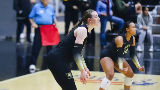 Mackenzie Lynch Sits in Serve Receive Against Loyola Maryland