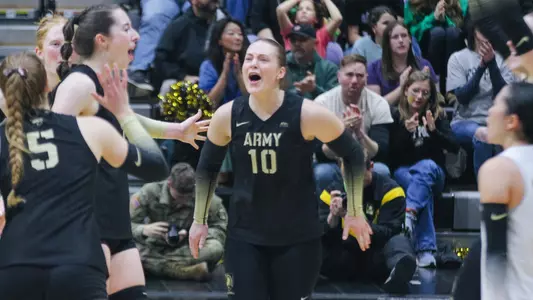 Naomi Chinchar Celebrates a Point With Her Teammates