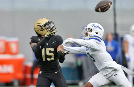 Nov 22, 2025; West Point, New York, USA; Army Black Knights running back Noah Short (15) catches a pass over Tulsa Golden Hurricane safety Keontez Bradley (3) during the first half at Michie Stadium. Mandatory Credit: Danny Wild-Imagn Images