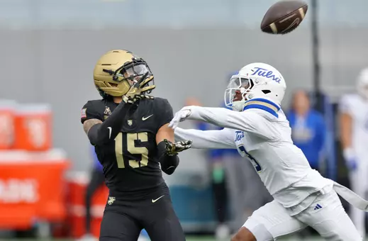 Nov 22, 2025; West Point, New York, USA; Army Black Knights running back Noah Short (15) catches a pass over Tulsa Golden Hurricane safety Keontez Bradley (3) during the first half at Michie Stadium. Mandatory Credit: Danny Wild-Imagn Images