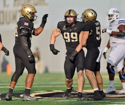 Nov 22, 2025; West Point, New York, USA; Army Black Knights defensive lineman Jack Bousum (99) celebrates his sack against the Tulsa Golden Hurricane during the second half at Michie Stadium. Mandatory Credit: Danny Wild-Imagn Images