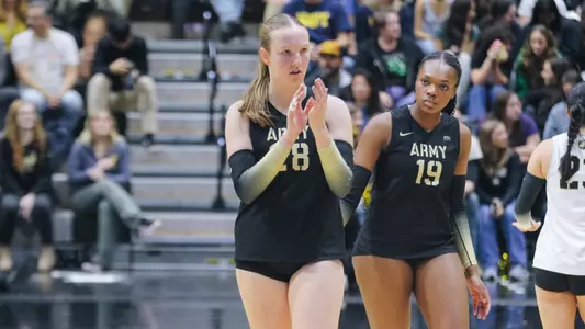 Corrine Blackburn and Kennedy Jones Listen to Instruction From Bench