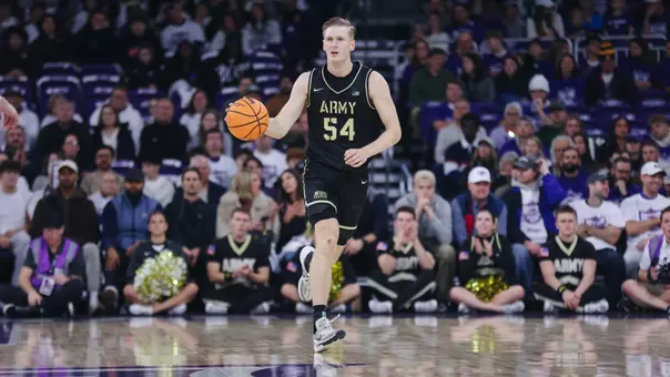 Jorn Everson Takes the Ball Down the Floor Against St. Thomas