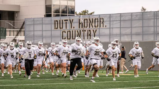 MLAX Team running out of team tunnel