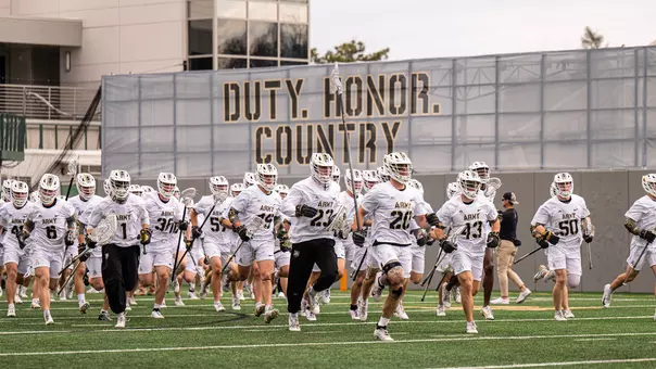MLAX Team running out of team tunnel