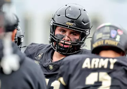 Brady Smalls faces the quarterback in the huddle