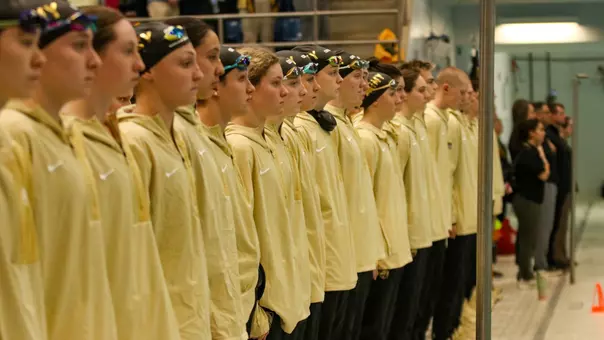Swimming & Diving Lined Up for National Anthem at Navy