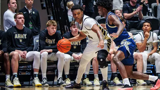 Jaxson Bells Drives the Ball Against George Washington