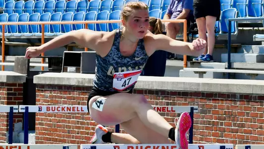 Zoe Eggleston Jumping Over a Hurdle