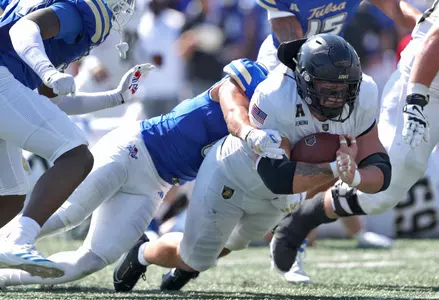 Oct 5, 2024; Tulsa, Oklahoma, USA; Army Black Knights running back Jake Rendina (33) lunges forward on a run against the Tulsa Golden Hurricane during the second half at Skelly Field at H.A. Chapman Stadium. Mandatory Credit: Danny Wild-Imagn Images
