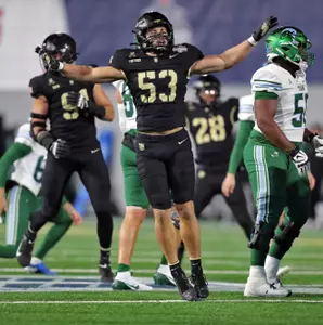 Dec 6, 2024; West Point, NY, USA; Army Black Knights linebacker Kalib Fortner (53) celebrates a missed field goal by Tulane during the first half at Michie Stadium. Mandatory Credit: Danny Wild-Imagn Images