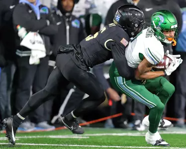 Dec 6, 2024; West Point, NY, USA; Tulane Green Wave wide receiver Dontae Fleming (1) catches a pass against the Army Black Knights during the second half at Michie Stadium. Mandatory Credit: Danny Wild-Imagn Images