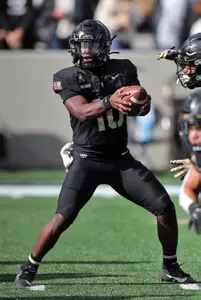 Nov 2, 2024; West Point, New York, USA; Army Black Knights quarterback Dewayne Coleman (10) arms up before the first half against the Air Force Falcons at Michie Stadium. Mandatory Credit: Danny Wild-Imagn Images