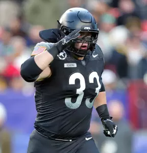 Dec 14, 2024; Landover, Maryland, USA; Army Black Knights running back Jake Rendina (33) salutes as he leaves the field during the first half of the the 125th Army-Navy game at Northwest Stadium. Mandatory Credit: Danny Wild-Imagn Images