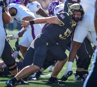 Owen Walter blocking on an extra point attempt against ECU