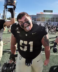 Oct 12, 2024; West Point, New York, USA; Army Black Knights offensive lineman Brady Small (51) and his teammates celebrate after a 44-10 win against the UAB Blazers at Michie Stadium. Army improved to 6-0 and became bowl eligible with the victory. Mandatory Credit: Danny Wild-Imagn Images