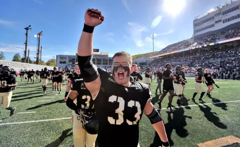 Oct 12, 2024; West Point, New York, USA; Army Black Knights running back Jake Rendina (33) and his teammates celebrate after a 44-10 win against the UAB Blazers at Michie Stadium. Army improved to 6-0 and became bowl eligible with the victory. Mandatory Credit: Danny Wild-Imagn Images