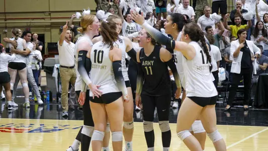 Volleyball Celebrates Winning a Point Against NAvy