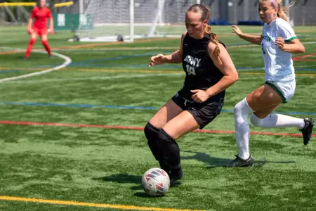 #19 Ailyn Rowe defends the ball against Manhattan's #3 in Army's 4-1 victory over Manhattan on August 17, 2025