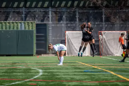 #30 Brigid Duffy and #17 Jordan Follenweider celebrate a goal in Army's 4-1 victory over Manhattan on August 17, 2025