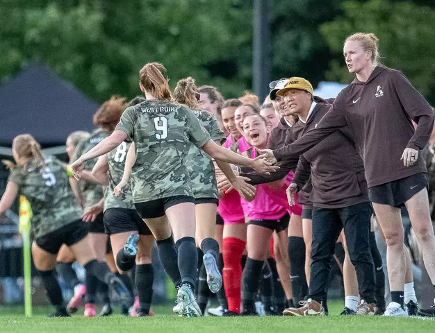 #9 Sophia Henry celebrates with Head Coach Tracy Chao and Assistant Coach Tori Ball in Army West Point's 2-1 victory over Air Force on Aug. 21, 2025