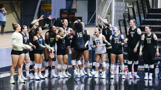 Army Bench Celebrates Point Against Seton Hall