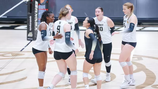 Volleyball Talking after a Point Against St. Thomas