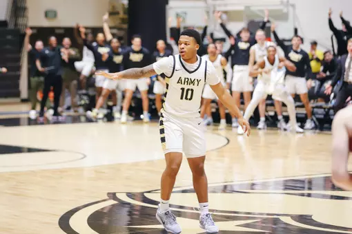 Jacen Holloway High-Fives Teammates Heading Down the Floor