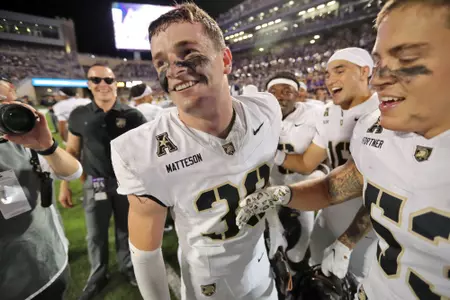 Sept. 6, 2025 — Collin Matteson is all smiles on the bench after Army's win over Kansas State at Bill Snyder Family Stadium in Manhattan, Kansas. Photo: Danny Wild/Army football