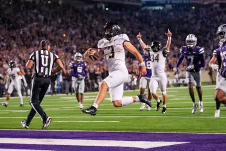 Quarterback Cale Hellums jumps into the end zone for a touchdown at Kansas State in 2025.