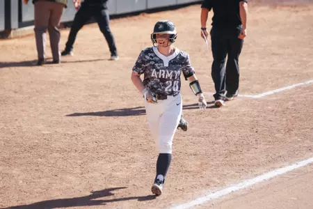 Caitlyn Newburn Runs to Home Plate after Scoring a Run