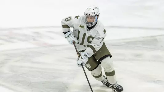 Vincent Salice (8) skates with the puck in a game at Tate Rink against Sacred Heart on Feb. 28, 2026