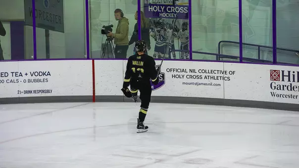 Rhys Wallin (12) celebrates a goal against Holy Cross at Hart Center Rink in Worcester, Mass. on Oct. 17, 2026