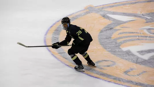 Brent Keefer (28) skates during a game against Quinnipiac on Oct. 24, 26 in Hamden, Conn.