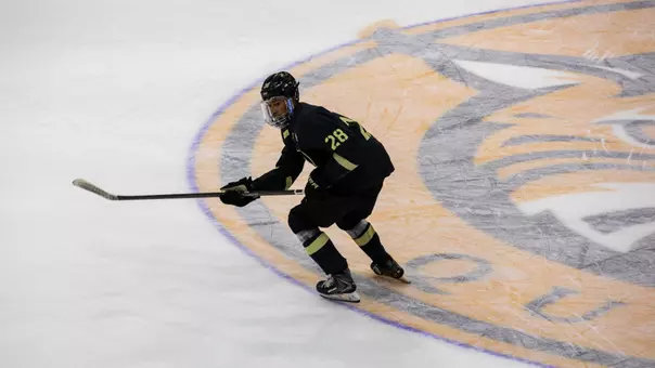 Brent Keefer (28) skates during a game against Quinnipiac on Oct. 24, 26 in Hamden, Conn.