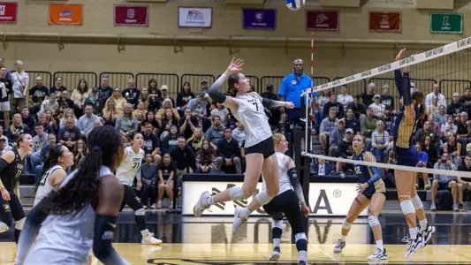 Michelle Parker goes up for hit against Navy