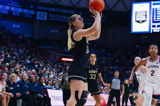 Camryn Tade takes a pull up jumper at Gampel Pavilion