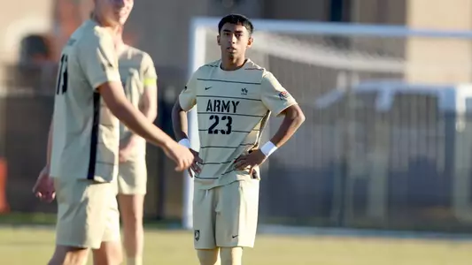 army men's soccer player runs on the field during a match against Bucknell