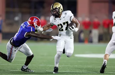 Samari Howard races down the field trying to evade a tackle