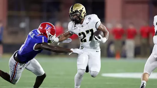 Samari Howard races down the field trying to evade a tackle