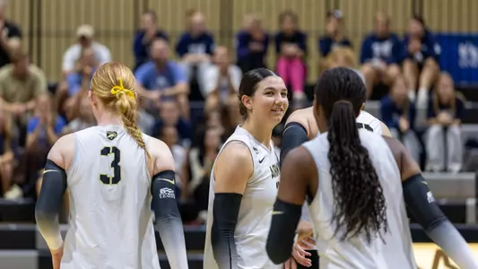 Marlee Lightsey Smiles while looking at the bench in Army's matchup against Lafayette