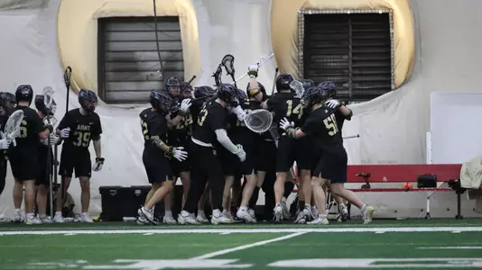 Men's Lacrosse Celebrating a Goal