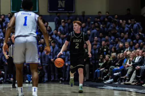 Ryan Curry Dribbles the Ball Down the Floor Against Duke