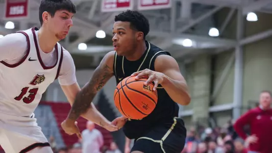 Jacen Holloway Drives the Ball Against Lafayette Defense